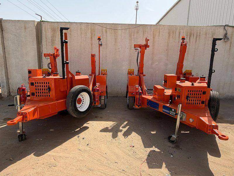 Rear view of cable drum trailers with their front support jacks Rear view of cable drum trailers with their front support jacks