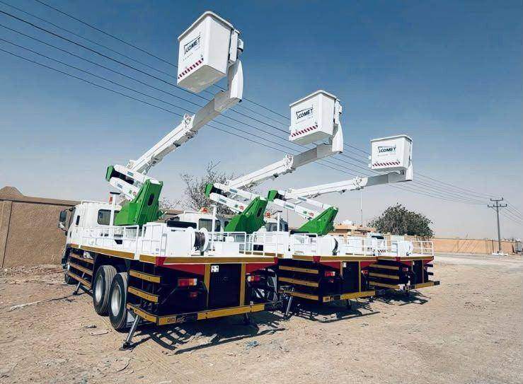 A row of insulated aerial platforms with booms raised in the handover yard A row of insulated aerial platforms with booms raised in the handover yard