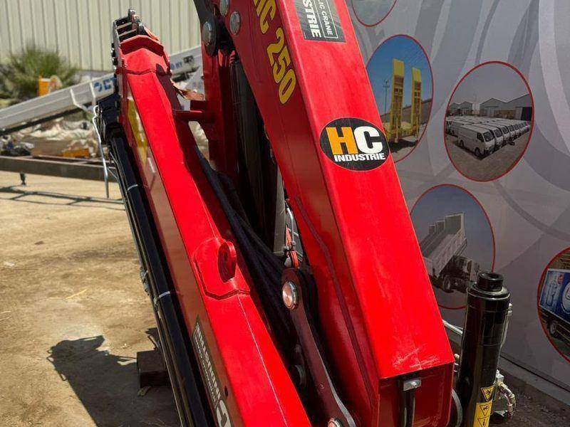HC 180 knuckle boom crane in its compact stowed position behind the cab