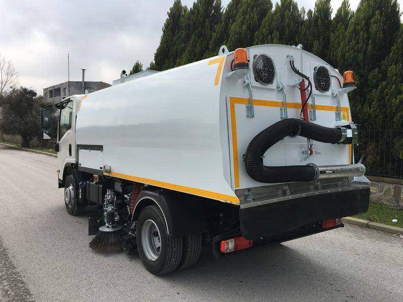 Road sweeper fitted with a water tank and spray system for dust suppression Road sweeper fitted with a water tank and spray system for dust suppression